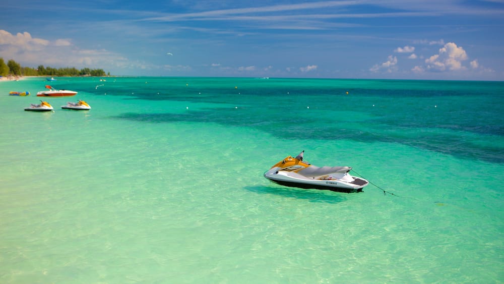 Taino Beach showing jet skiing and general coastal views