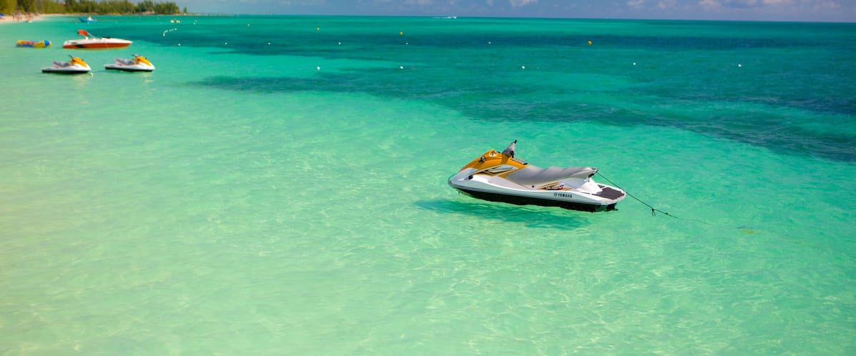 Taino Beach showing jet skiing and general coastal views
