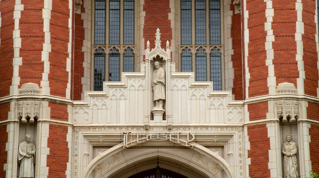 Bizzell Library which includes a statue or sculpture and heritage elements