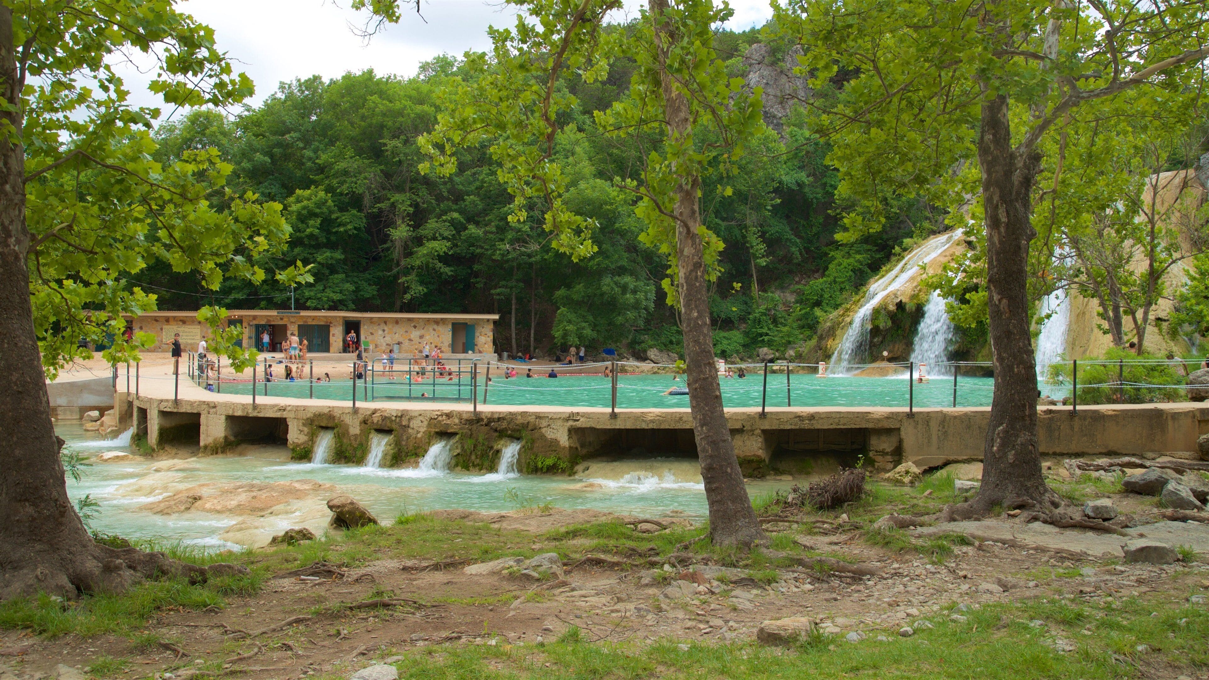 Turner Falls featuring a cascade and a lake or waterhole