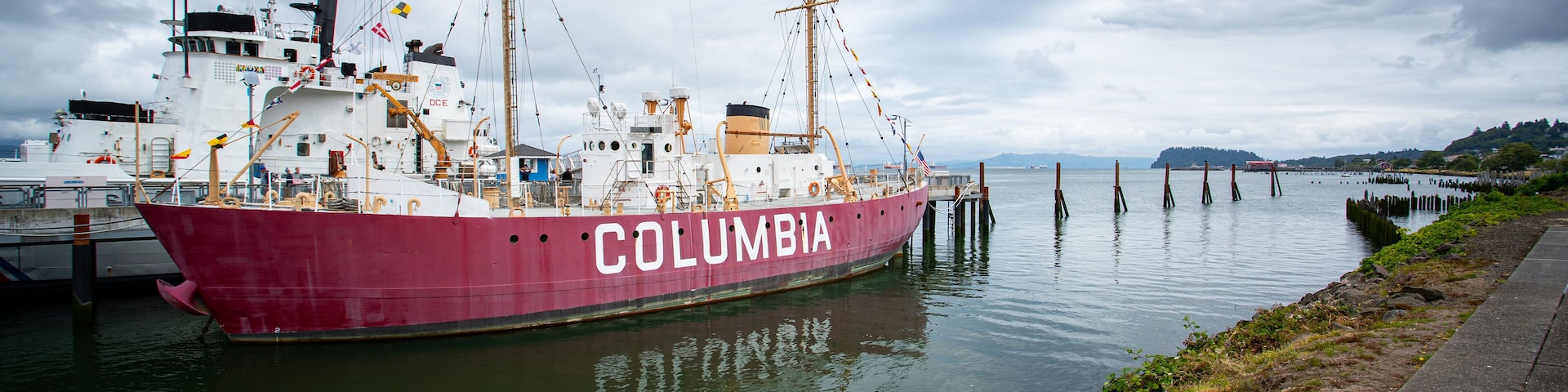 Columbia River Maritime Museum which includes a bay or harbor and signage