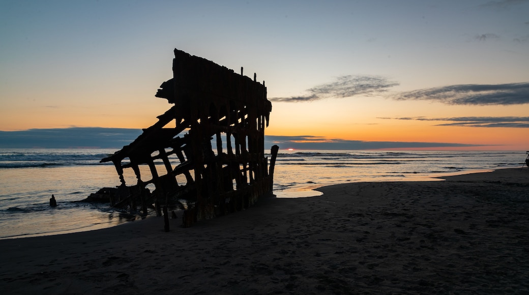 Fort Stevens State Park featuring general coastal views, a sunset and building ruins