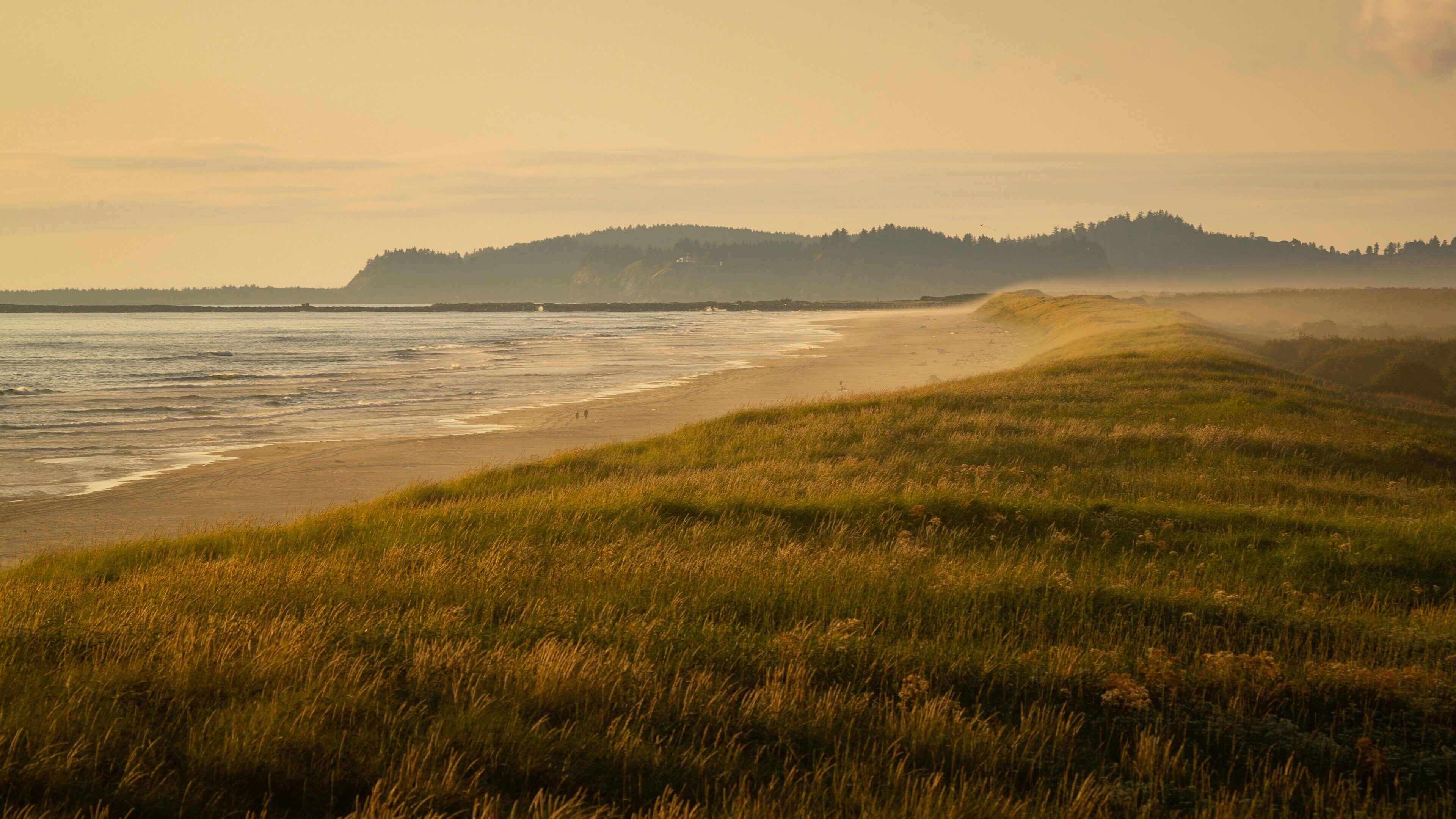 Fort Stevens State Park showing general coastal views, a beach and a sunset