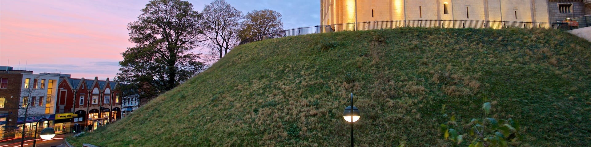 Norwich Castle featuring a sunset and heritage architecture