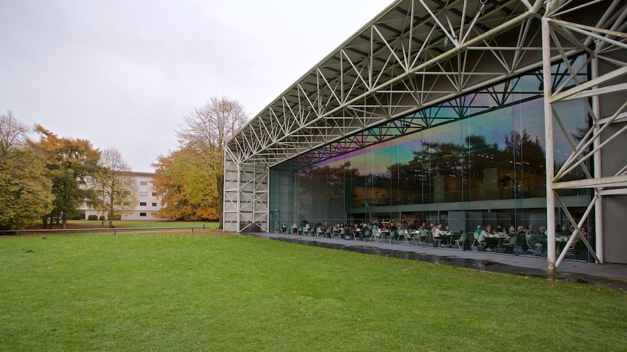 Sainsbury Centre for the Visual Arts showing modern architecture and a garden as well as a small group of people