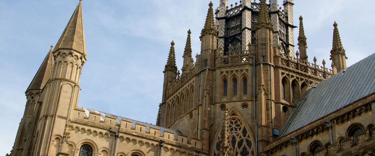 A Gothic cathedral with pointed arches, intricate stonework, and multiple spires.