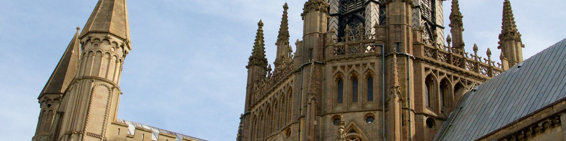 A Gothic cathedral with pointed arches, intricate stonework, and multiple spires.