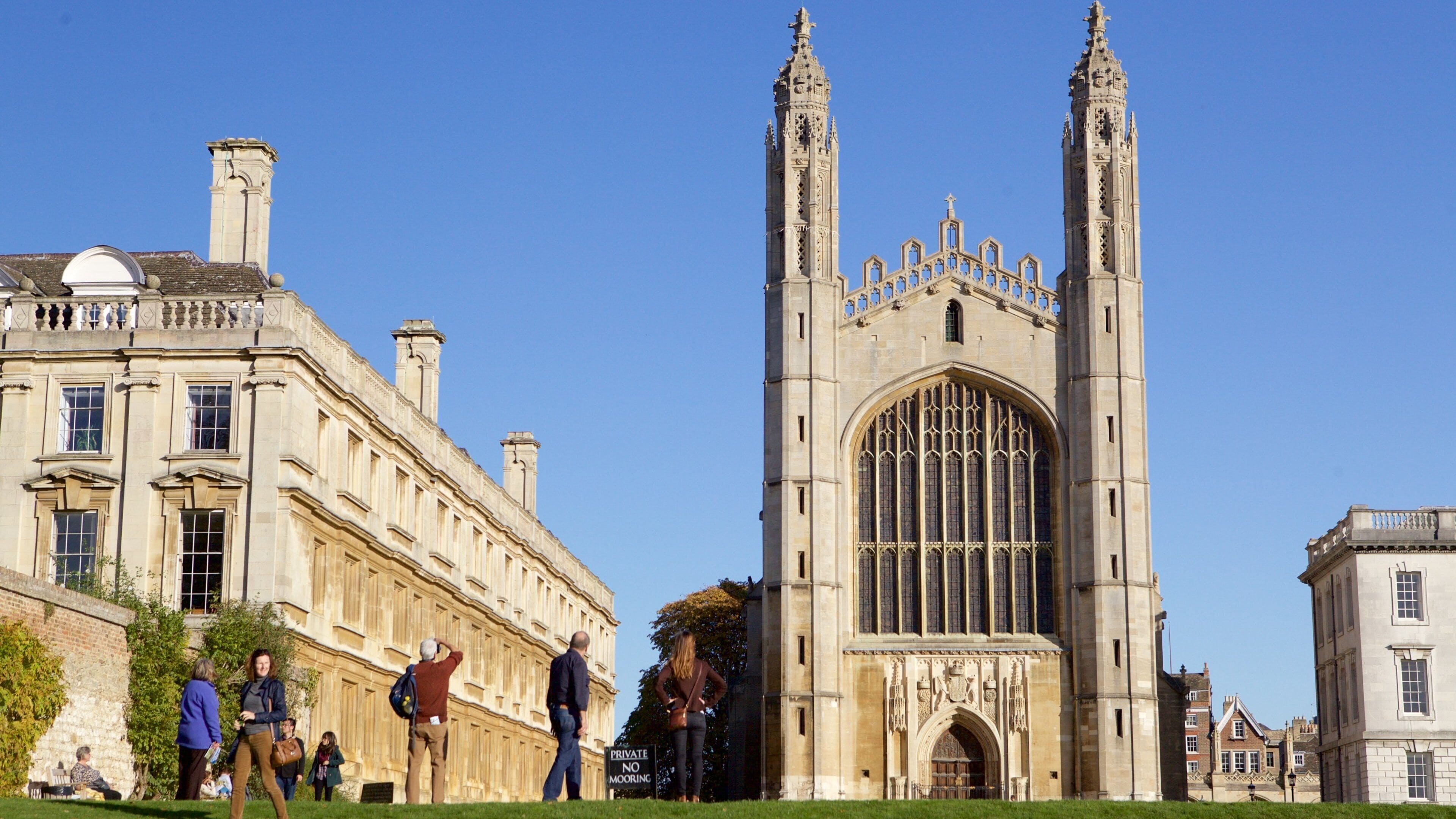 A historic building with a large arched window and two tall towers.