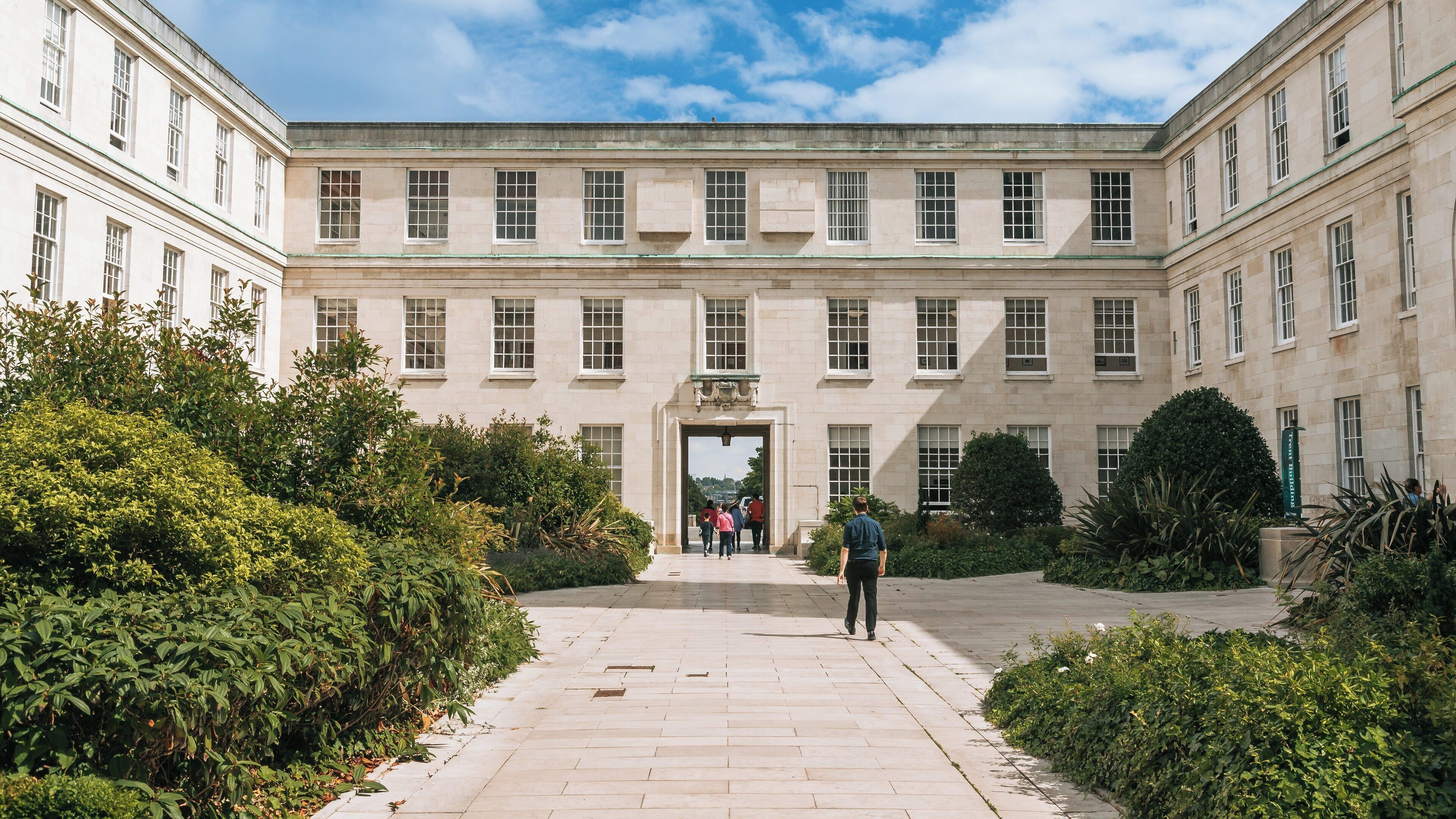 University of Nottingham courtyard features classic architecture amidst greenery on a sunny day in Nottingham, England