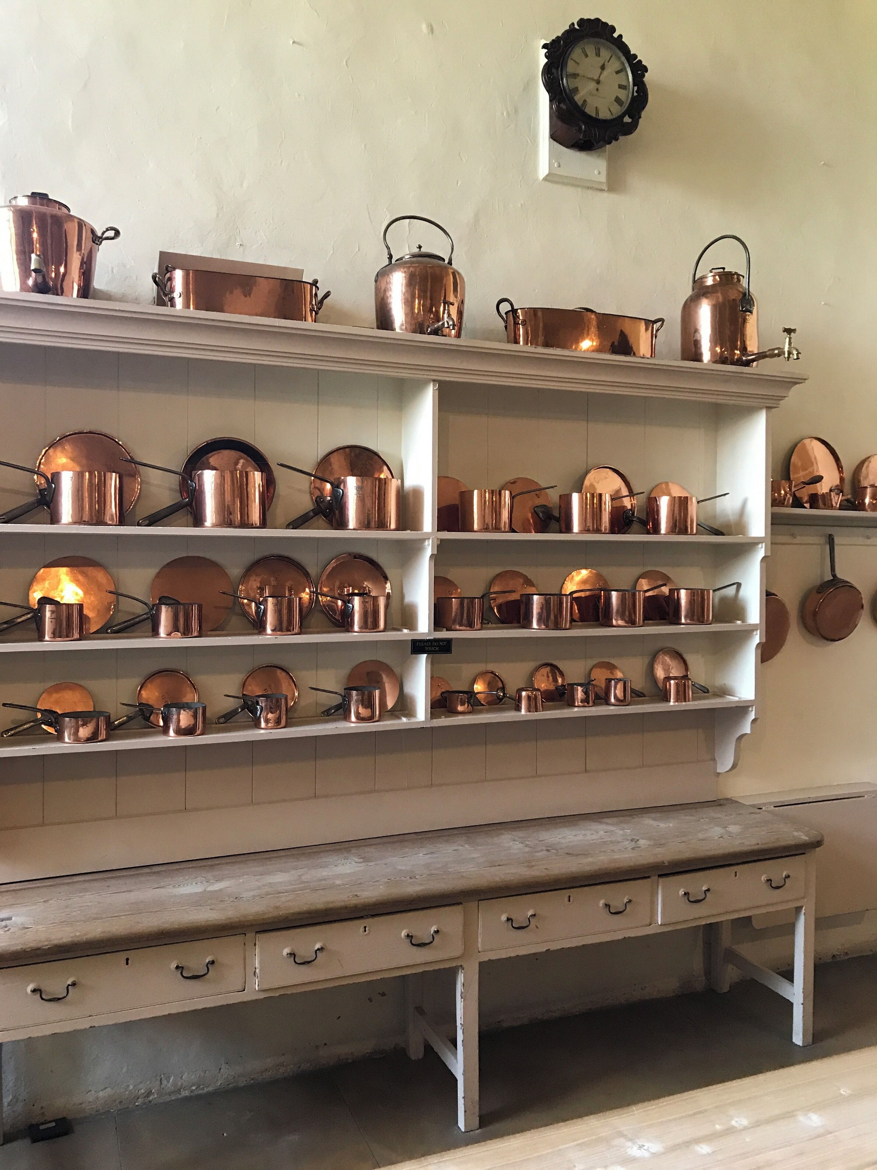 Copper kitchenware on display in the kitchen at Hardwick Hall
