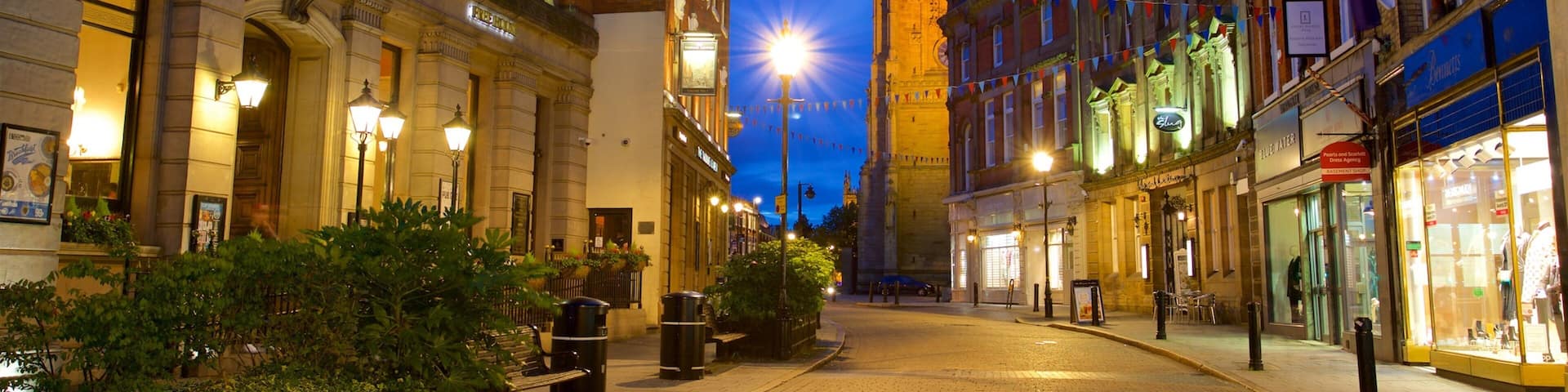 Derby Cathedral which includes a city, night scenes and heritage architecture