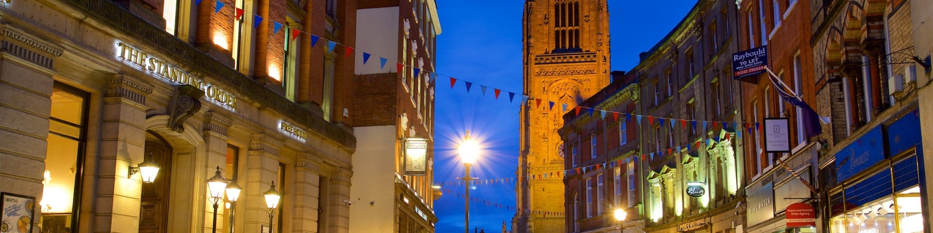 Derby Cathedral which includes a city, night scenes and heritage architecture