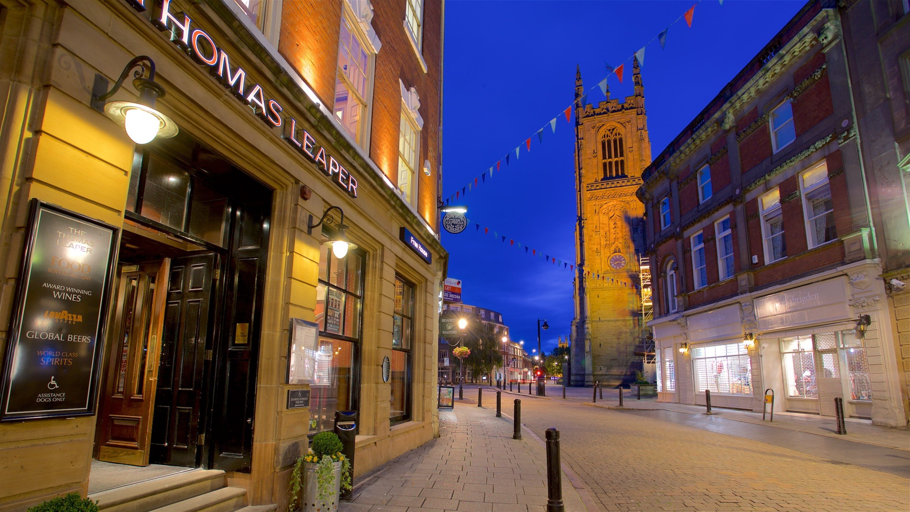 Derby Cathedral which includes night scenes and heritage architecture