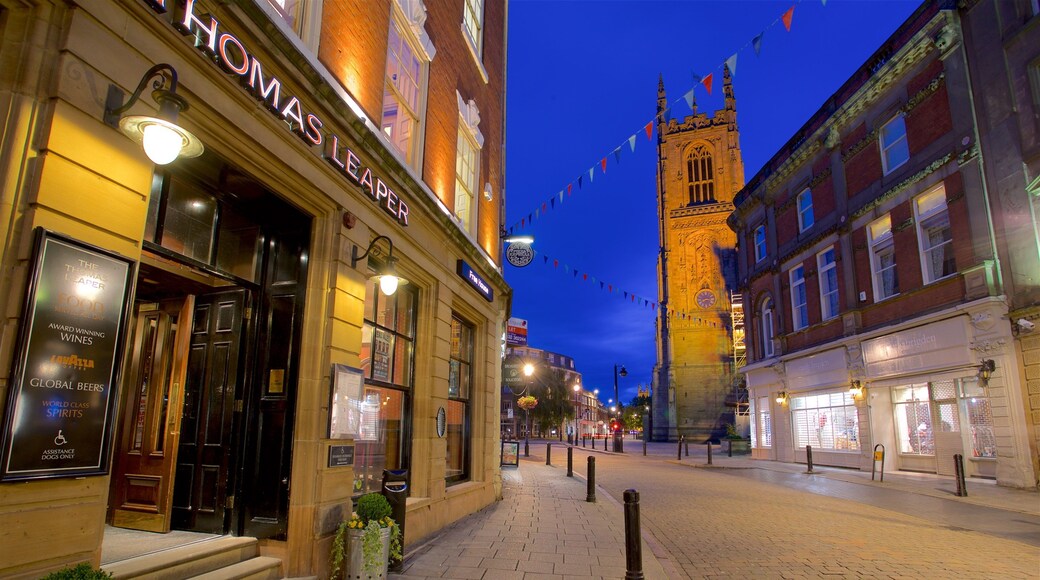 Derby Cathedral which includes night scenes and heritage architecture