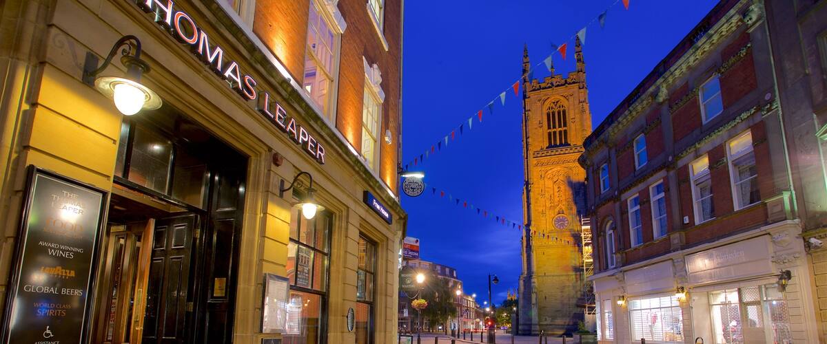 Derby Cathedral which includes night scenes and heritage architecture