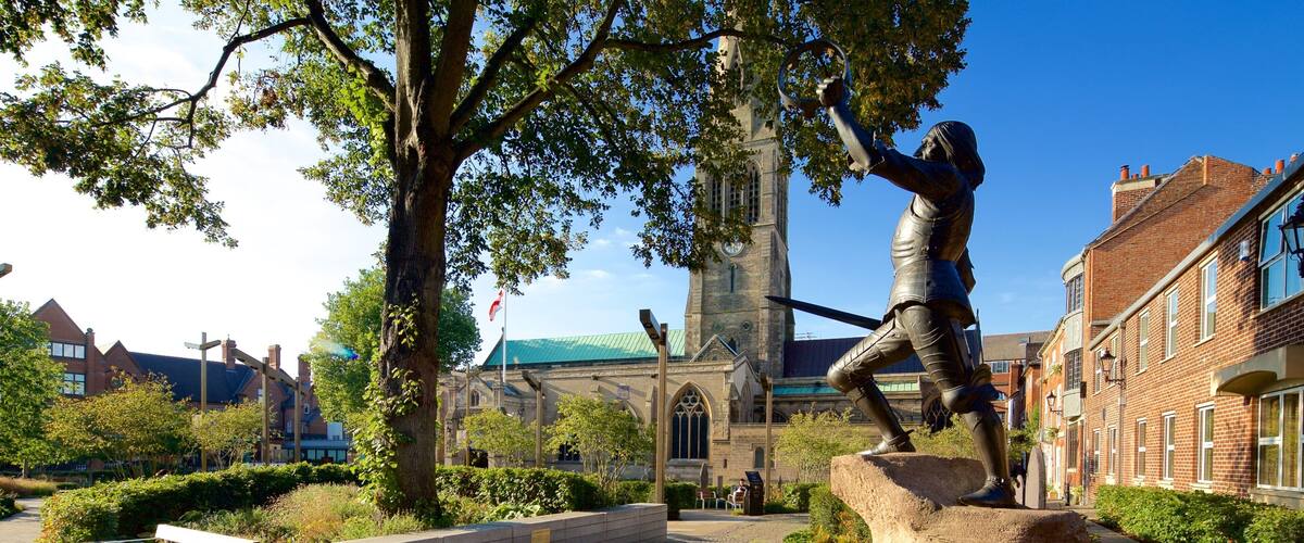 Leicester Cathedral showing a garden, a square or plaza and a statue or sculpture