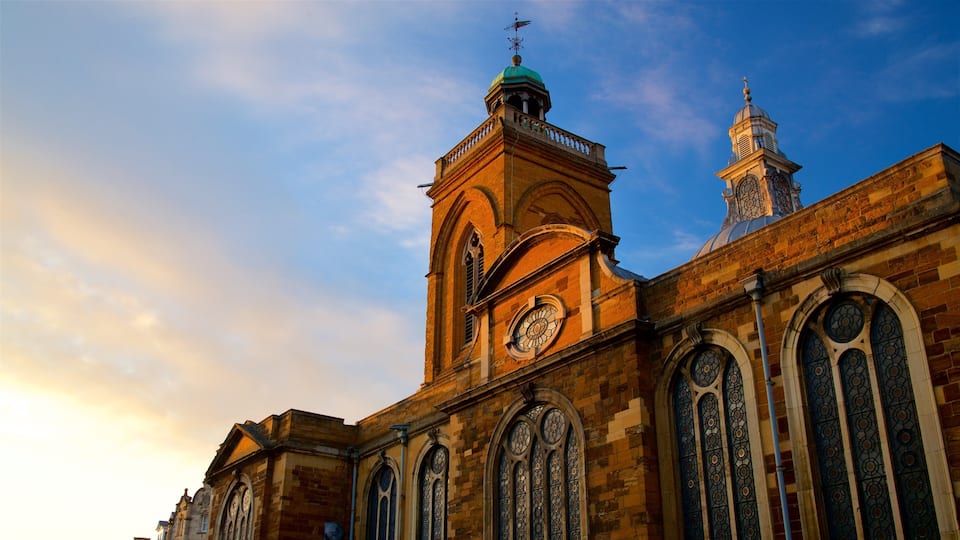 A historic church with a clock tower and stained glass windows.