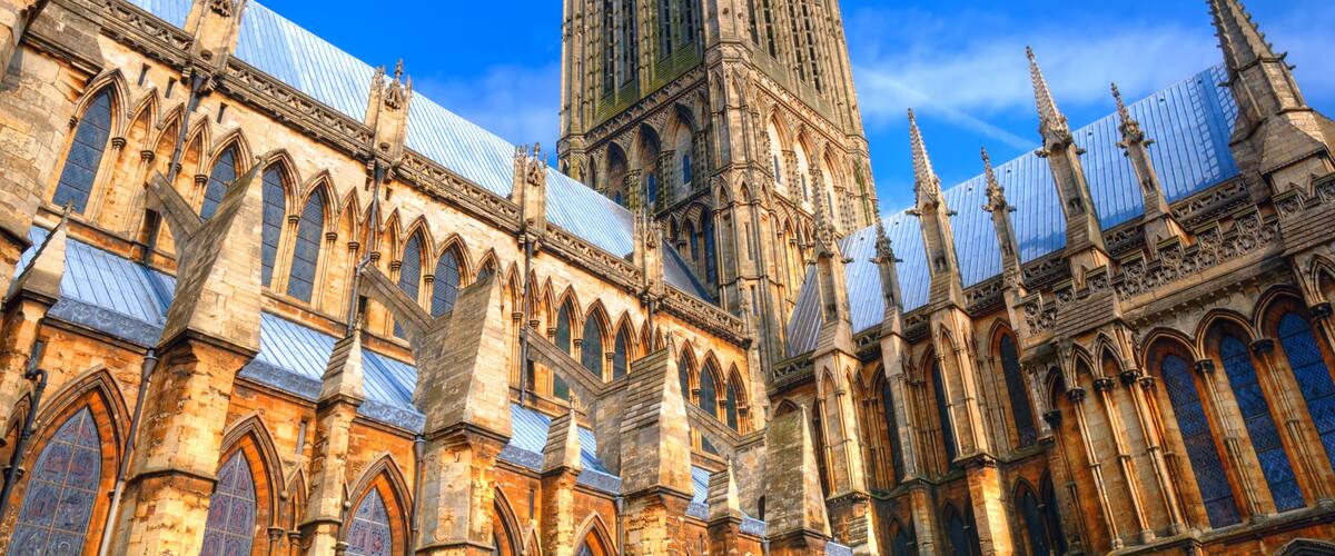 A historic cathedral with intricate Gothic architecture, including pointed arches and a tall spire.