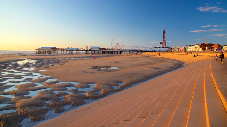 Blackpool Central Pier featuring a sunset, a sandy beach and general coastal views