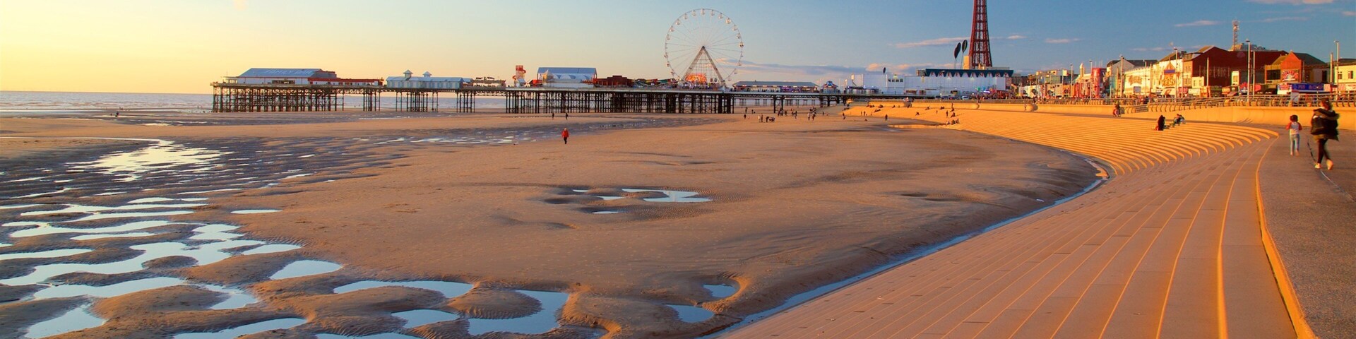 Blackpool Central Pier featuring a sunset, a sandy beach and general coastal views