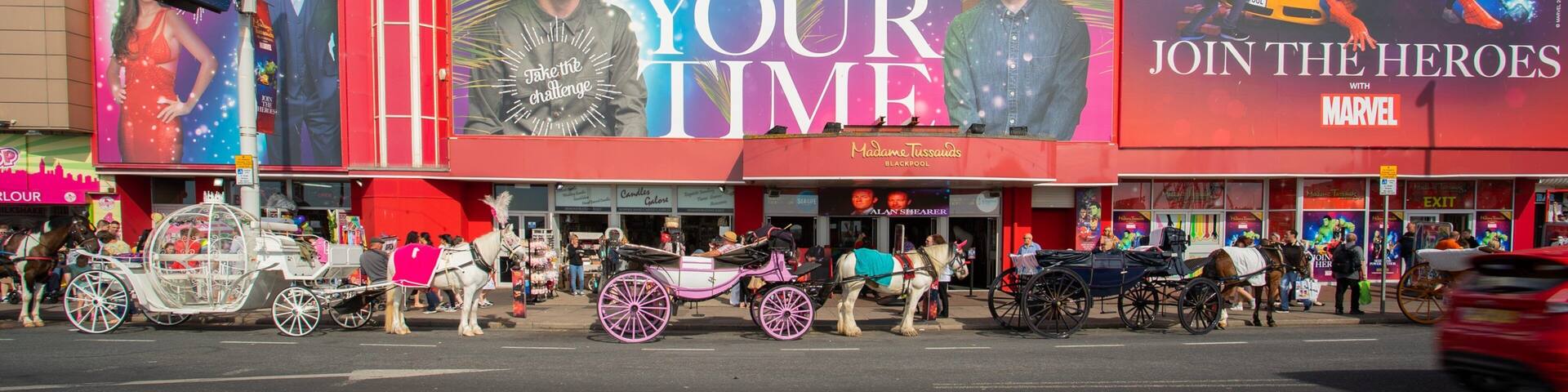 Madame Tussauds Waxworks which includes signage
