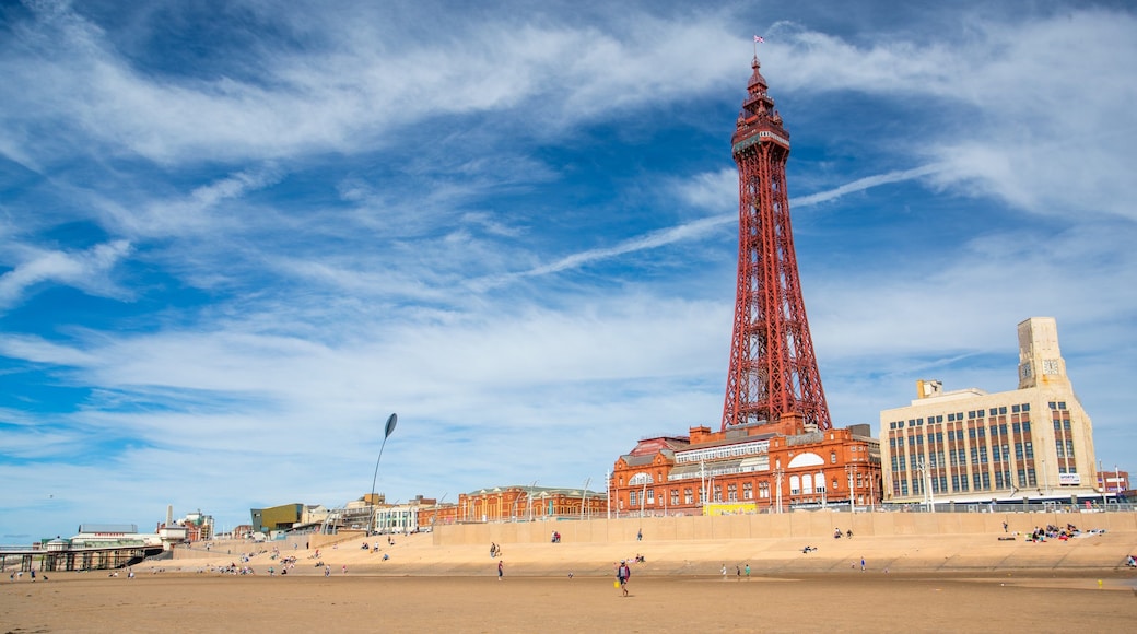 Blackpool which includes a coastal town and a sandy beach