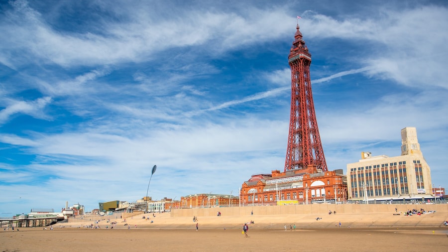 Blackpool which includes a coastal town and a sandy beach