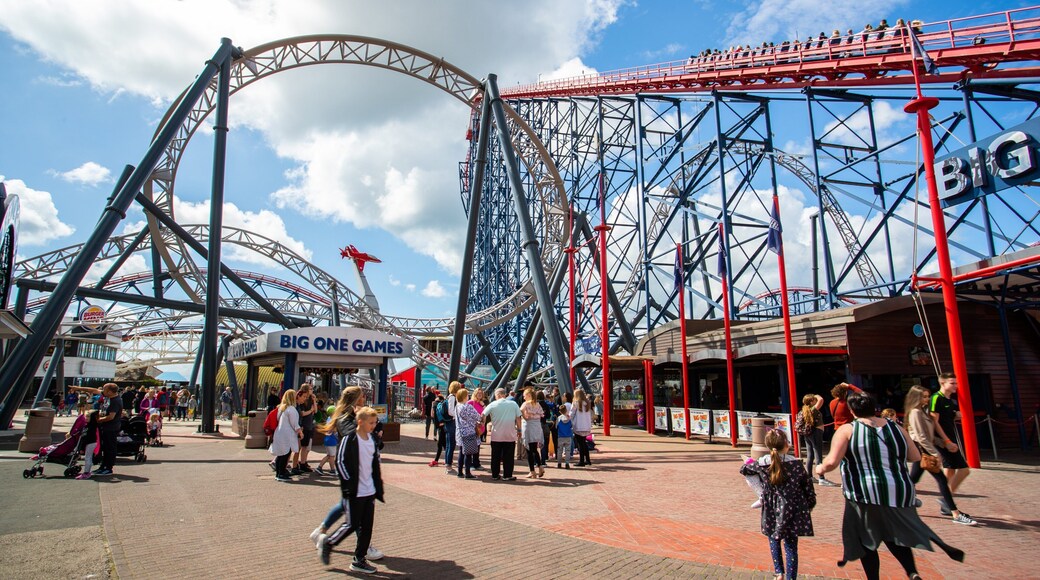 Blackpool Pleasure Beach featuring rides as well as a small group of people