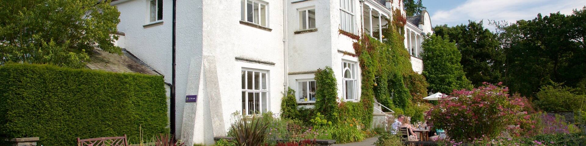 Lake District Visitor Centre at Brockhole featuring a house, a park and heritage elements