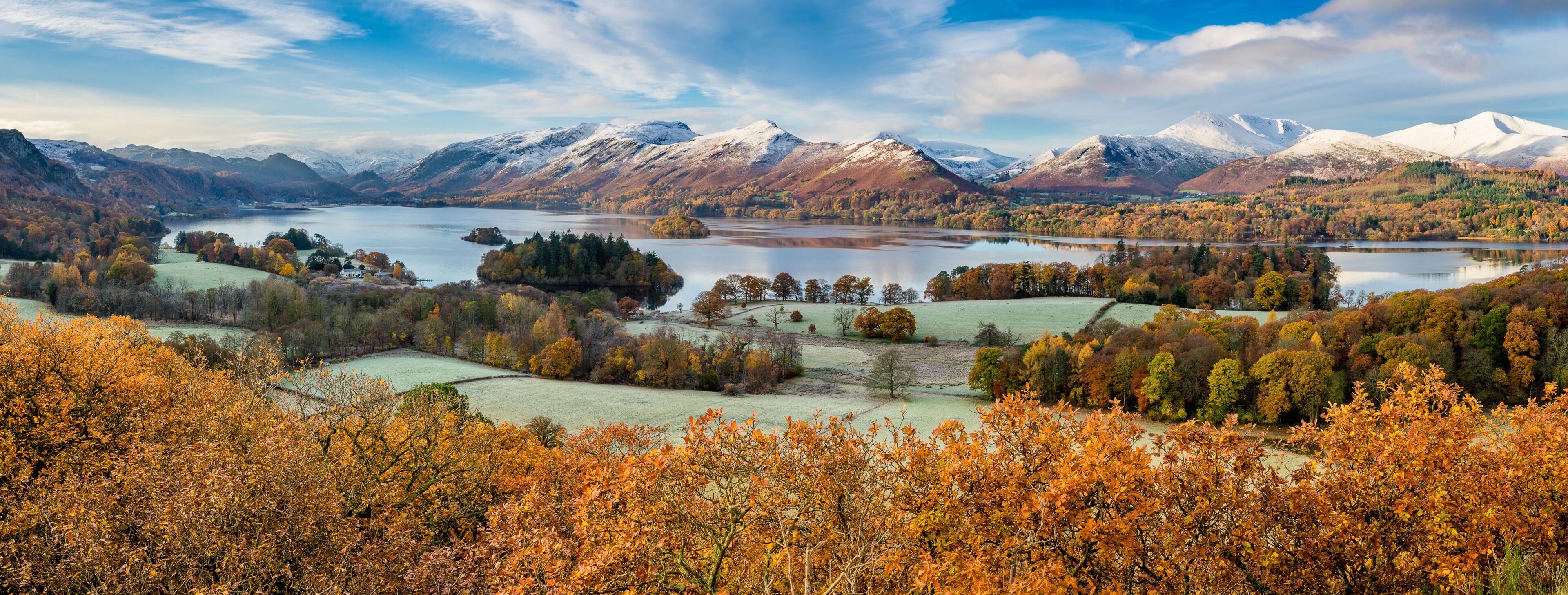 Beautiful view of Derwentwater in the English Lake District on a frosty Autumn morning with snow on the fells.
