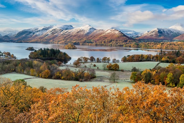 Beautiful view of Derwentwater in the English Lake District on a frosty Autumn morning with snow on the fells.
