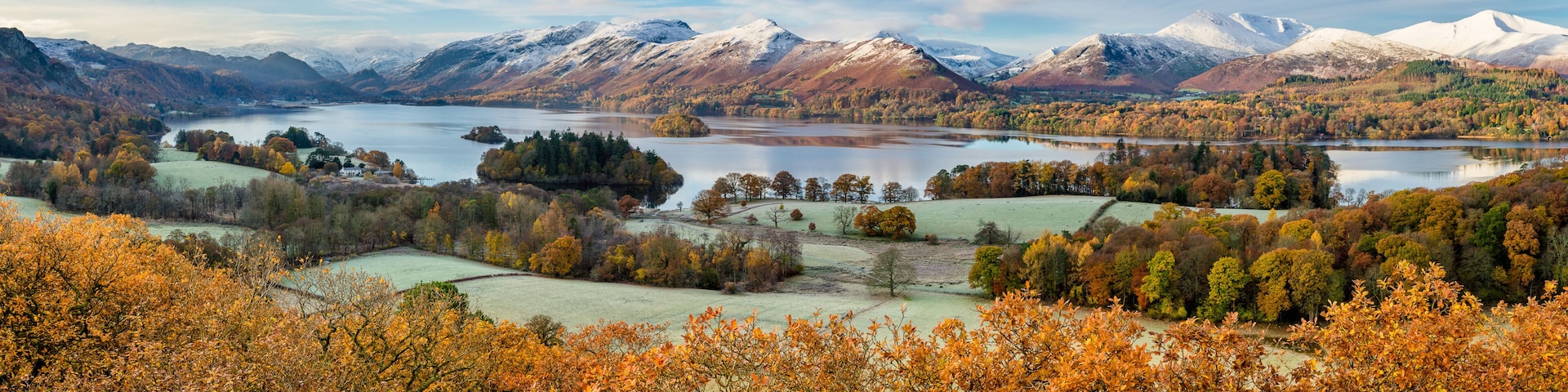 Beautiful view of Derwentwater in the English Lake District on a frosty Autumn morning with snow on the fells.
