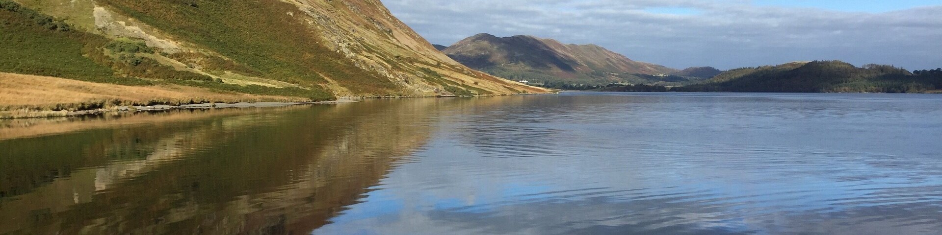 Crummock water to left is the bottom edge of Melbreak .. You can walk round the lake . Great pub in loweswater close by The Kirkstile Inn ( real ale ..good food )