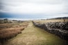 About the fort:
Barracks normally occupied the remainder of the fort; at Hardknott, however, no traces of these remain, although the front of the fort possibly contained barracks of stone and timber. At the rear, building would have been extremely difficult owing to the uneven ground, and the soldiers may have been housed in leather tents, remnants of which have been recovered in excavations. The parade-ground, where the garrison exercised and practised drill manoeuvres, lies on a plateau about 218 yards (200 metres) to the east.