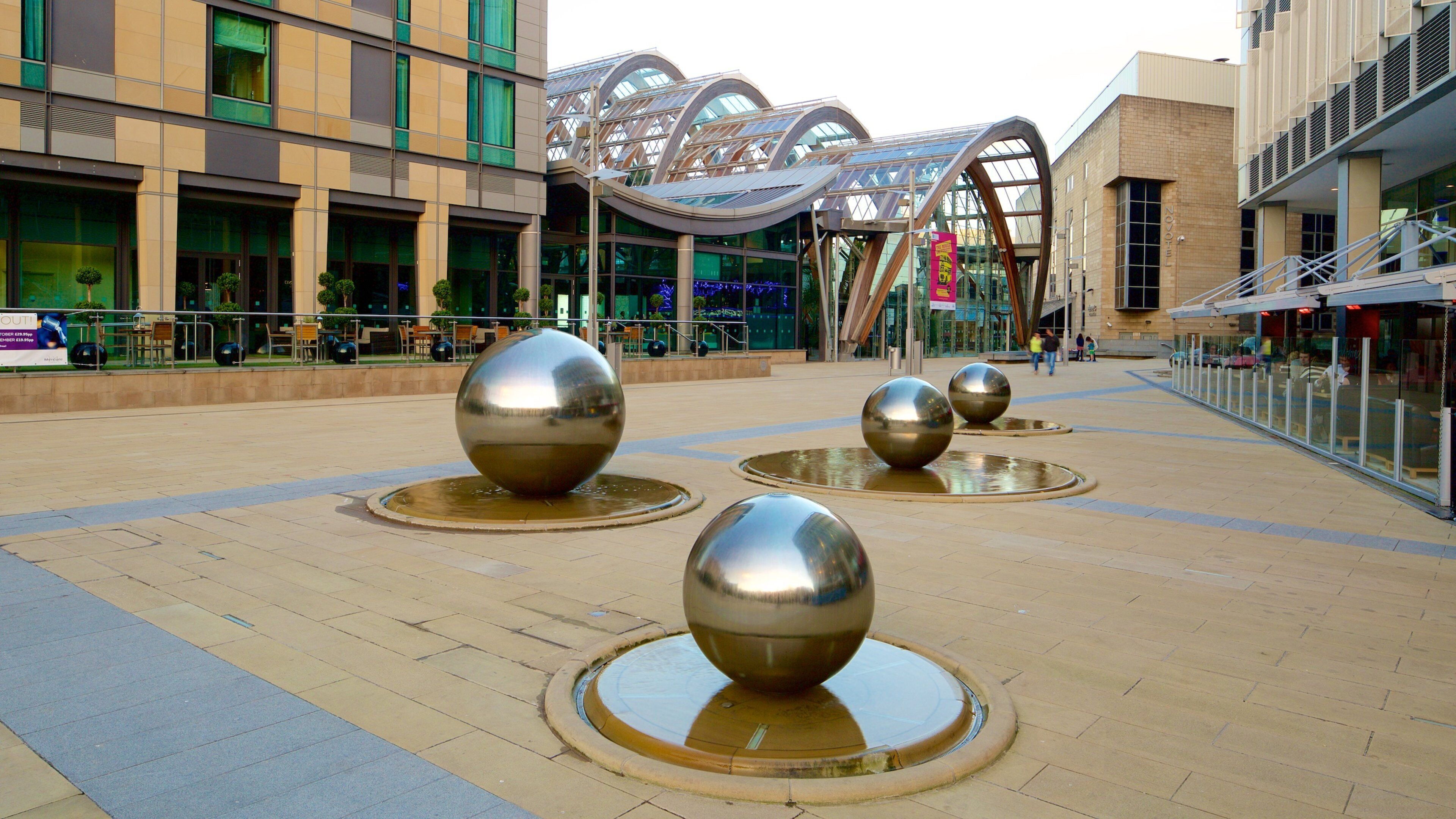 Sheffield Winter Garden which includes modern architecture, a fountain and a square or plaza