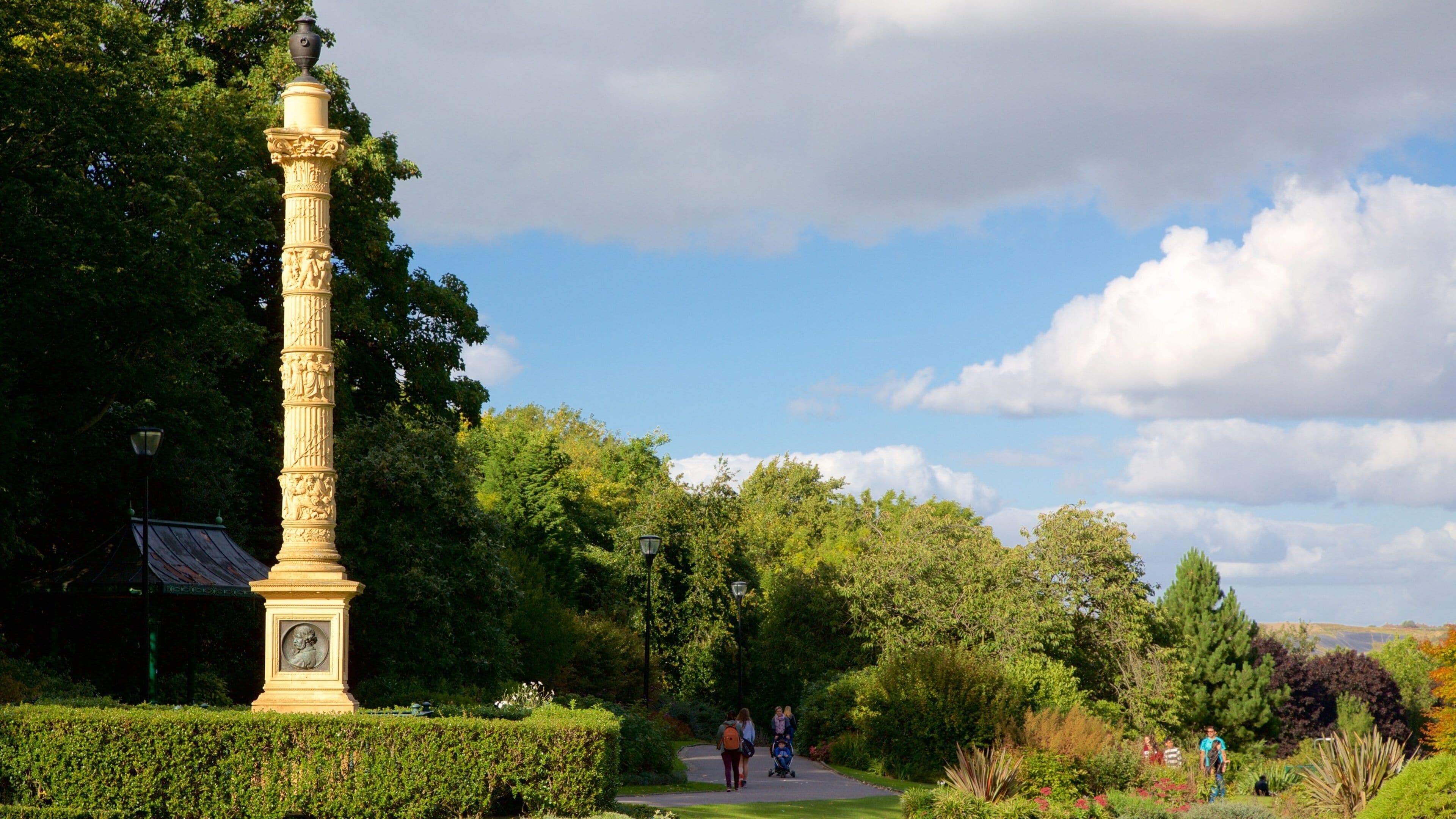 Weston Park Museum showing a monument and a garden