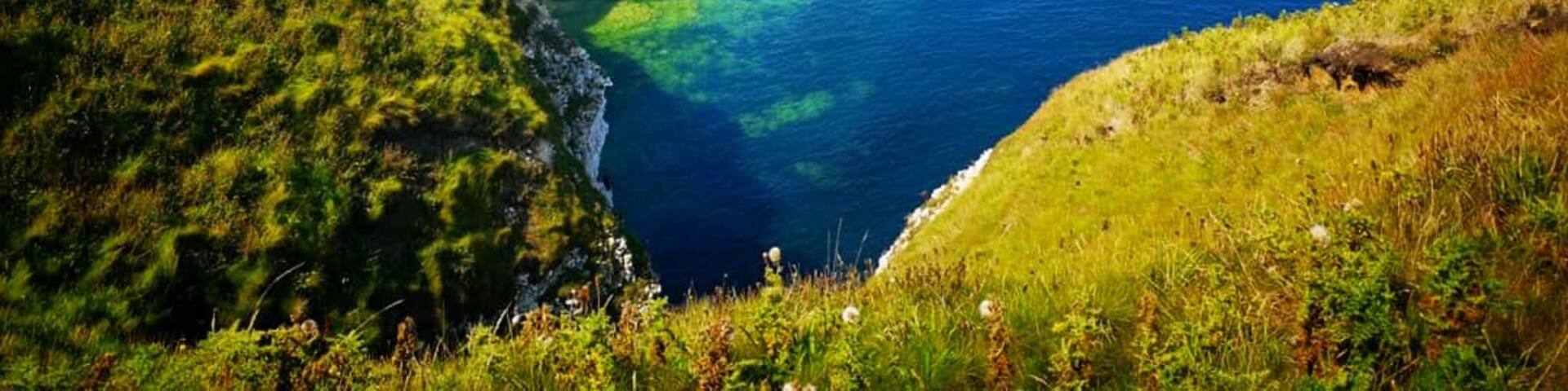 Flamborough Head is a promontory, 8 miles long on the Yorkshire coast of England, between the Filey and Bridlington bays of the North Sea. It is a chalk headland, with sheer white cliffs. The cliff top has two standing lighthouse towers, the oldest dating from 1669 and Flamborough Head Lighthouse built in 1806.