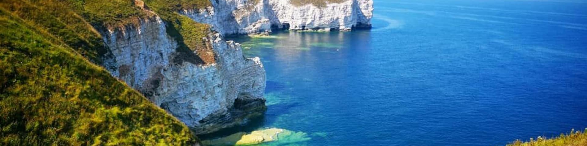 Flamborough Head is a promontory, 8 miles long on the Yorkshire coast of England, between the Filey and Bridlington bays of the North Sea. It is a chalk headland, with sheer white cliffs. The cliff top has two standing lighthouse towers, the oldest dating from 1669 and Flamborough Head Lighthouse built in 1806.