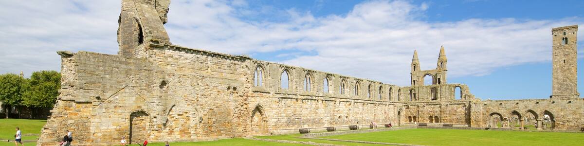 An ancient stone structure with a tall tower and arched windows.