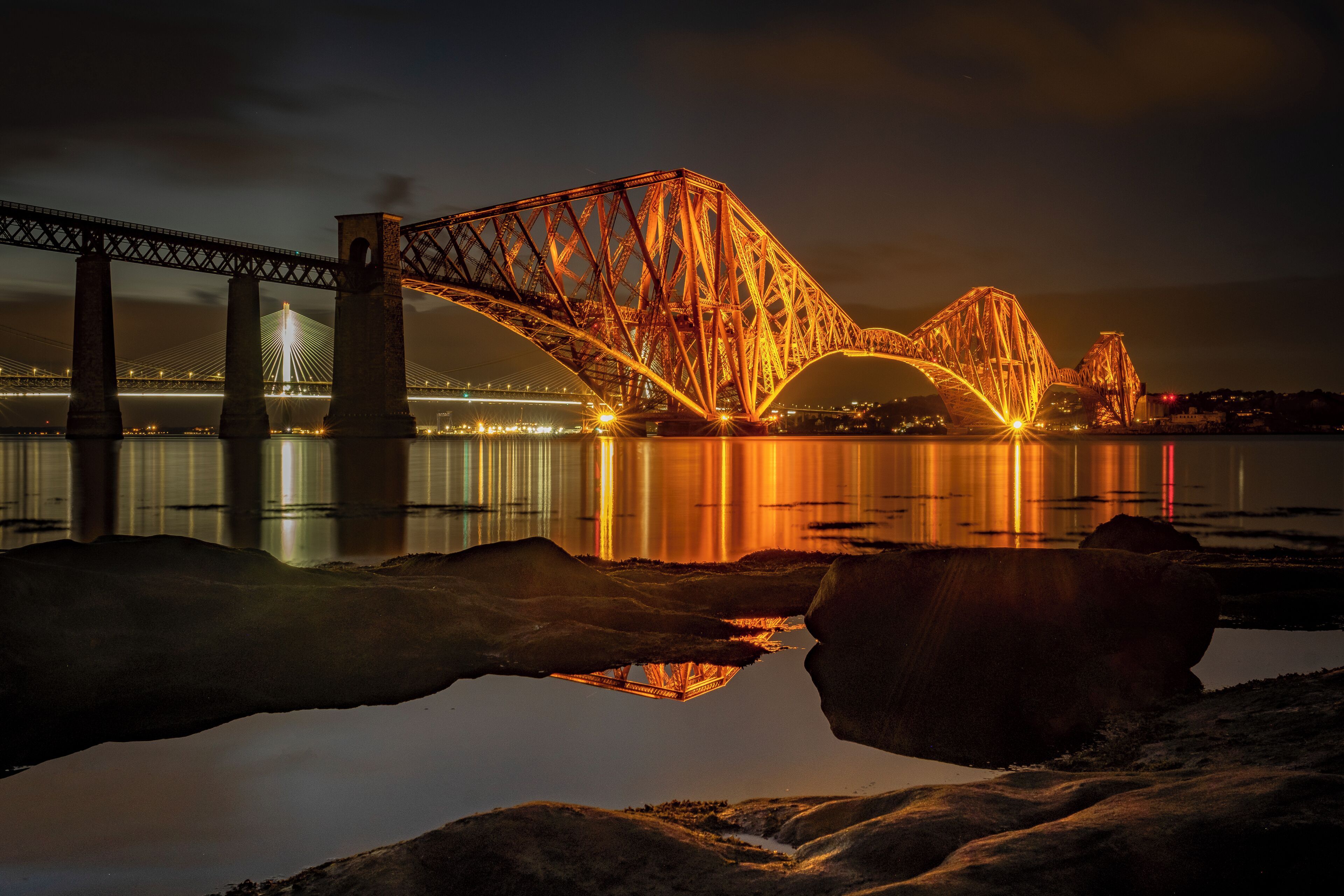 The Forth Bridge is a cantilever railway bridge across the Firth of Forth in the east of Scotland, 9 miles west of central Edinburgh. It is considered as a symbol of Scotland, and is a UNESCO World Heritage Site. It was designed by the English engineers Sir John Fowler and Sir Benjamin Baker. 
Construction started: 1882
Total length: 2,529 m