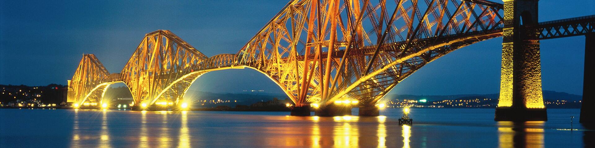 Forth Rail Bridge illuminating Queensferry, Edinburgh, Scotland