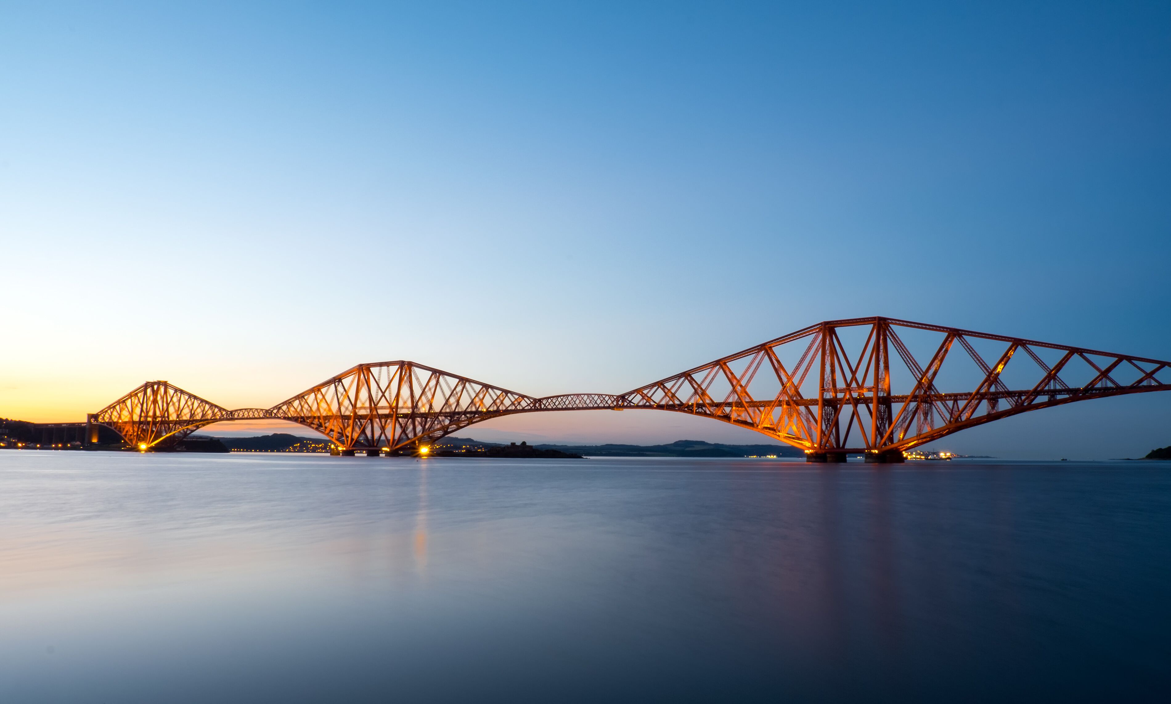 The famous Forth Rail Bridge in Scotland after sunset