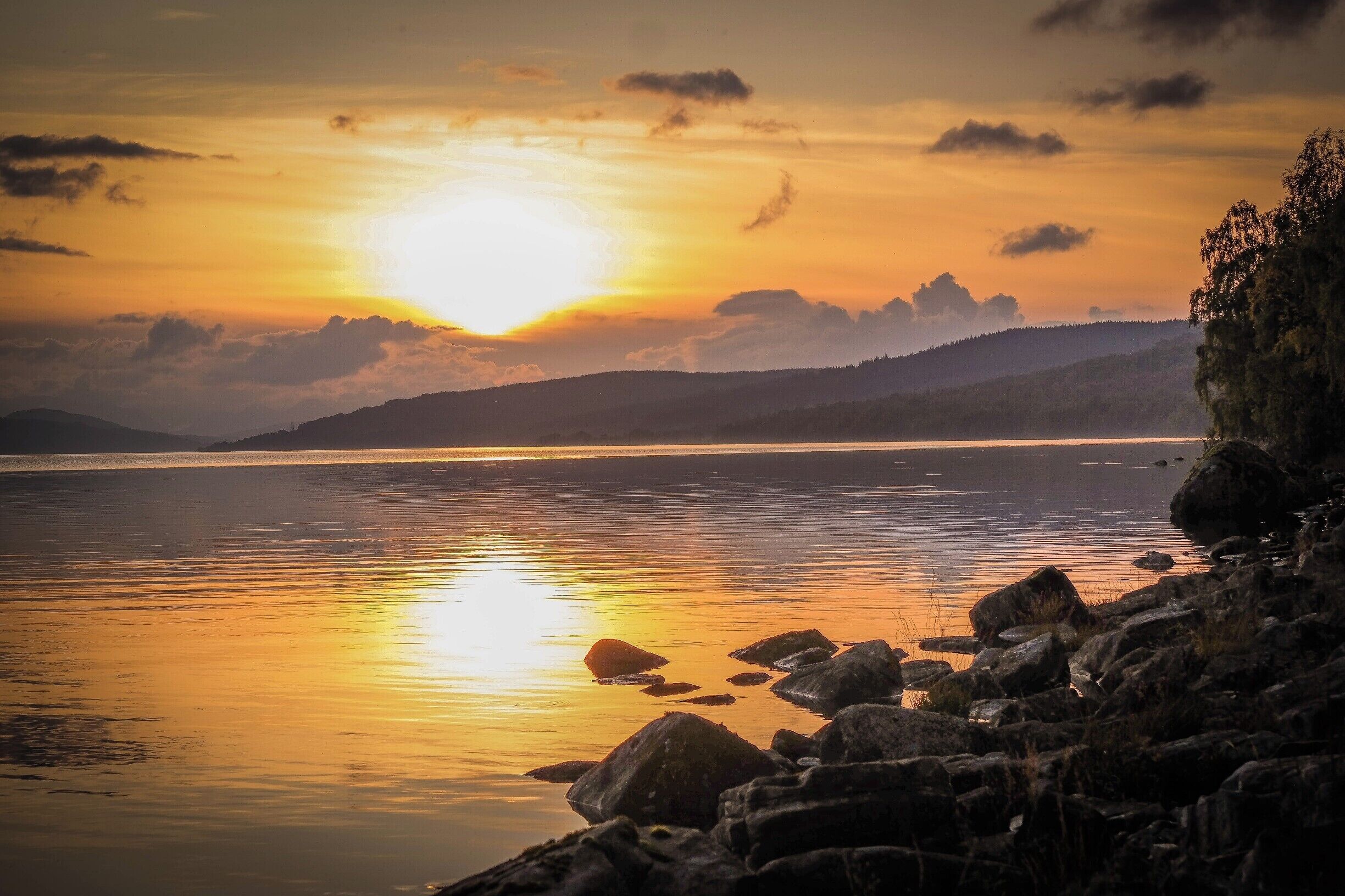Loch Rannoch at sunset. This is on the north shore where, if you continue west the road stops and the only access  to Fort William is on a simple path, the best way of course.