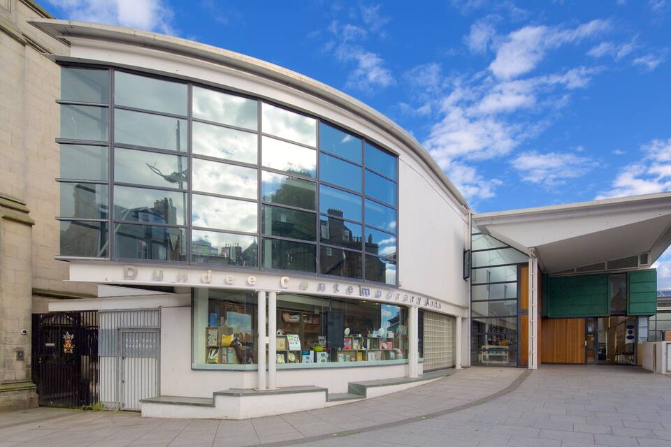 A modern building with large windows and a sign that reads "Dundee Contemporary Art Gallery."
