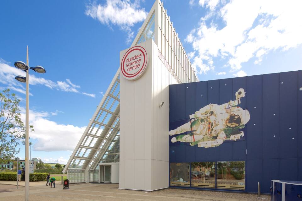 The Dundee Science Centre with a distinctive glass structure and a mural of an astronaut.