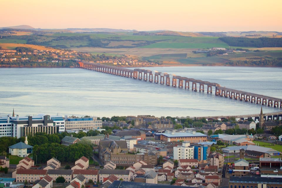 A coastal town with a long bridge extending into the water.