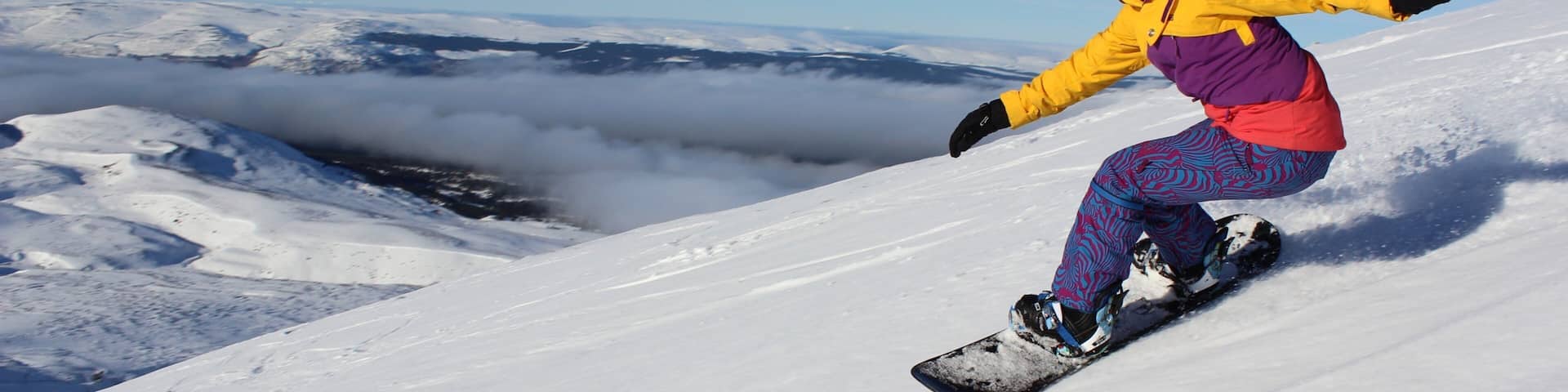 Cairngorm Ski Resort featuring snow boarding and snow as well as an individual femail
