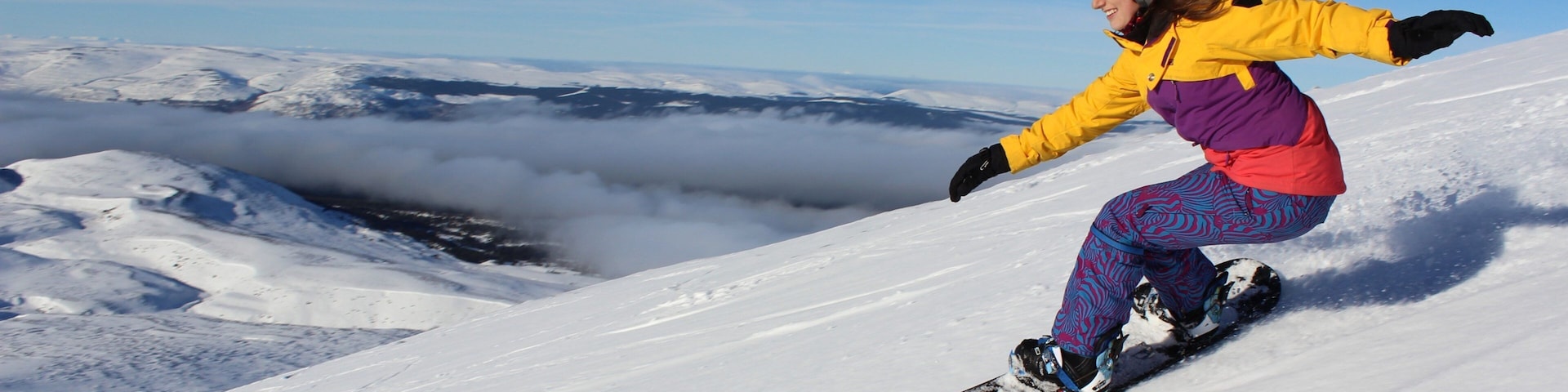 Cairngorm Ski Resort featuring snow boarding and snow as well as an individual femail