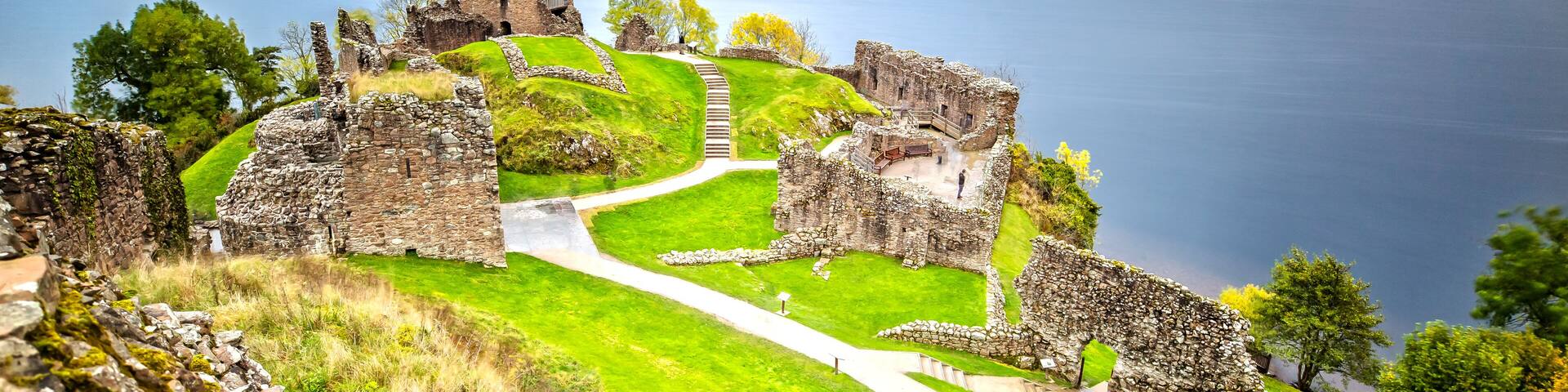 Urquhart Castle with Dark Cloud Sky and Loch Ness in the Background