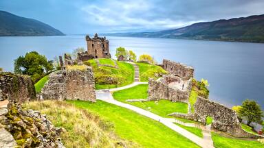 Urquhart Castle with Dark Cloud Sky and Loch Ness in the Background
